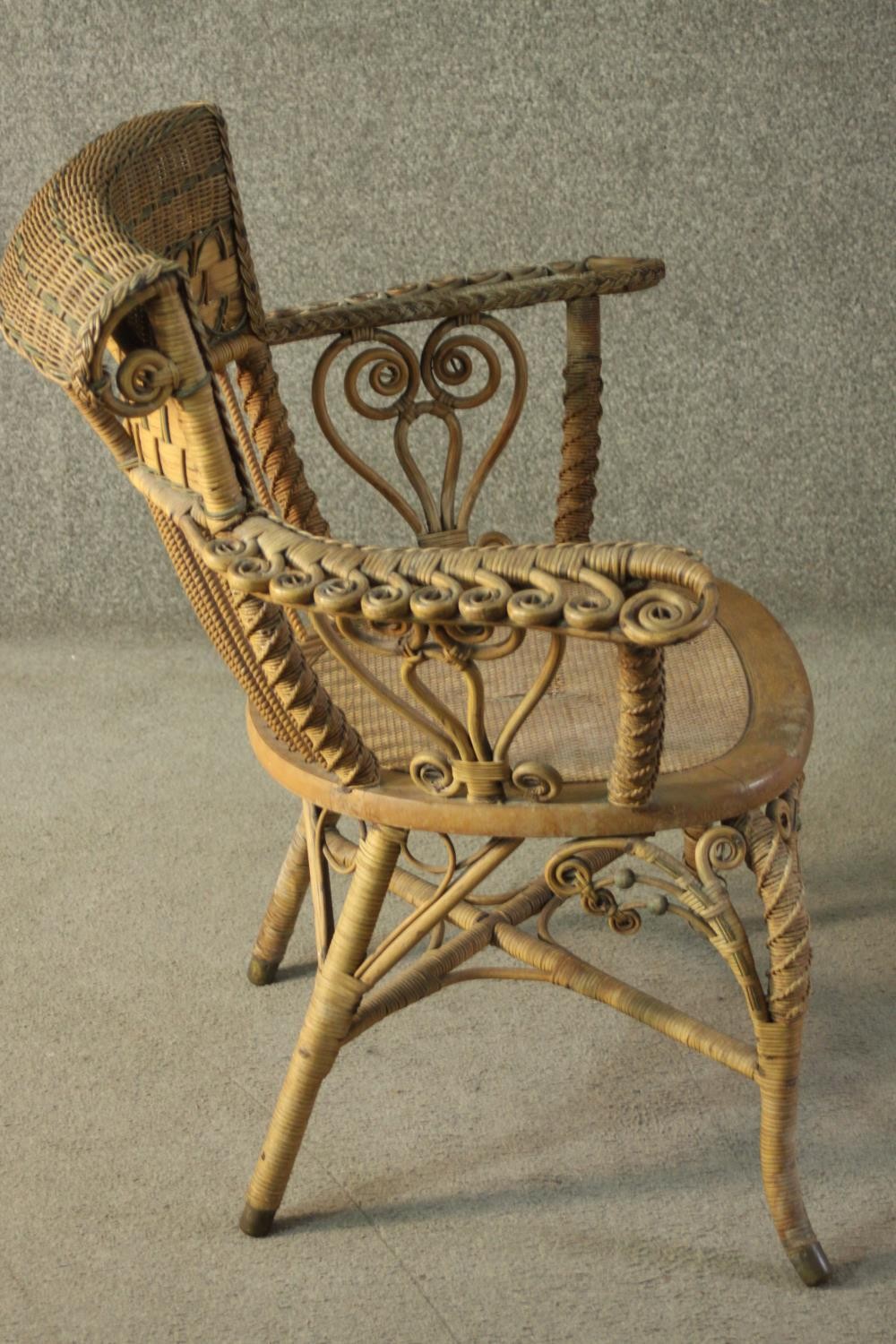A late 19th/early 20th century wicker open armchair, with a rattan woven backrest, the arms with - Image 3 of 7