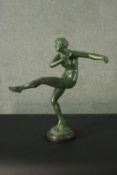 An Art Deco style spelter figure of a female dancer mounted on a black marble base. Indistinctly