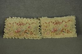 A pair of Aubusson type rectangular cushions, depicting a ribbon tie over a basket of flowers,