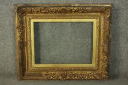 A 19th century giltwood and gesso frame, glazed and with slip. H.66 W.79cm.
