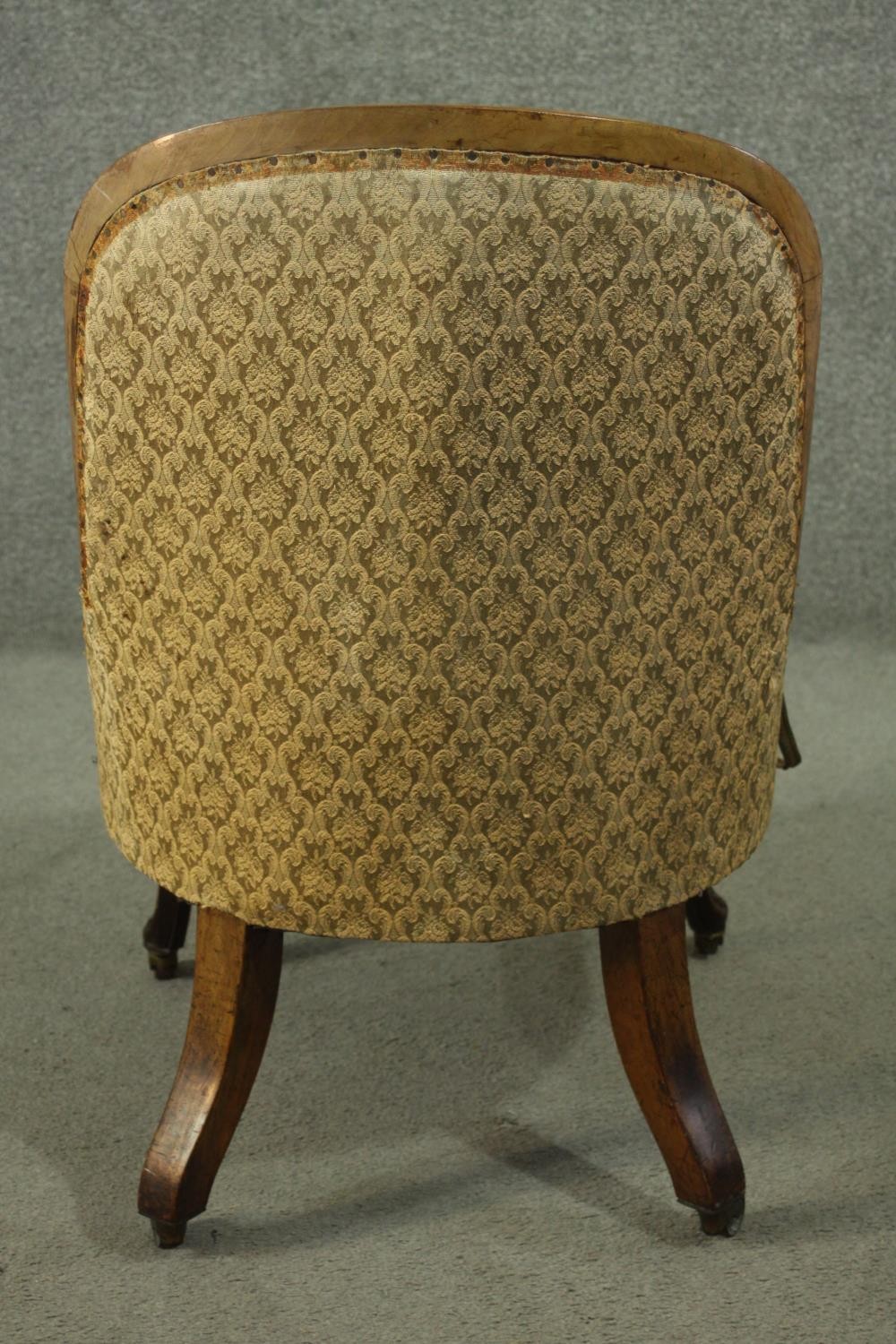 A Victorian walnut nursing chair, upholstered in green fabric, on carved cabriole legs. - Image 4 of 5
