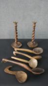 A pair of vintage oak barleytwist candlesticks along with a collection of five carved rustic
