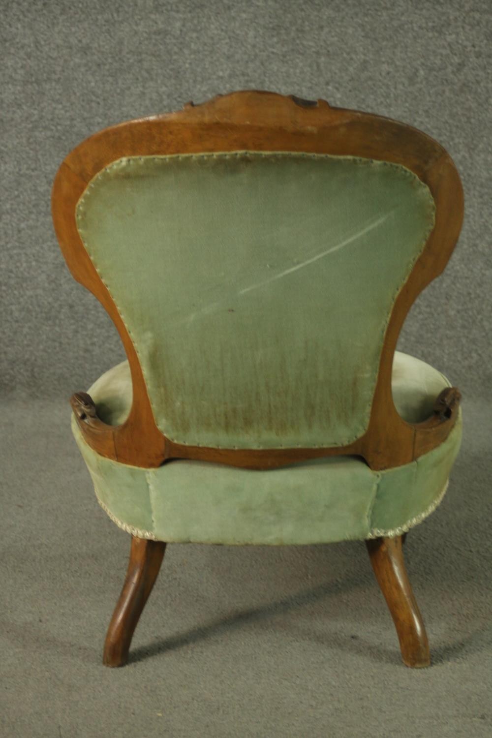 A late 19th century French walnut nursing chair, upholstered with green velour to the buttoned - Image 4 of 6