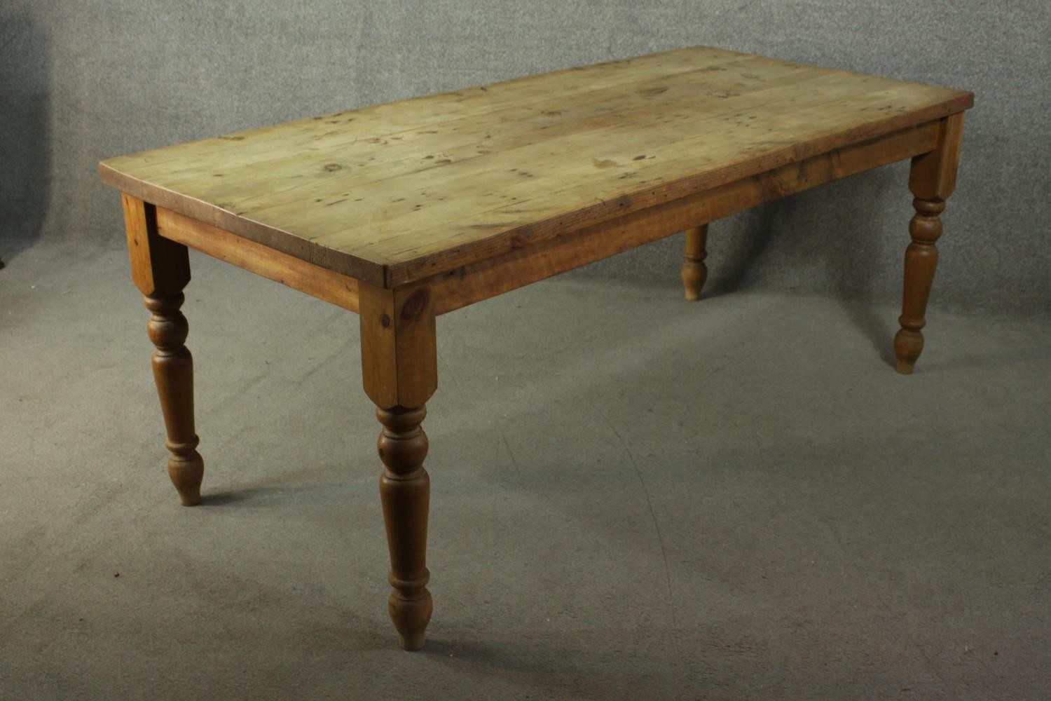 A pine refectory farmhouse dining table, with a rectangular top, on turned legs. - Image 7 of 7