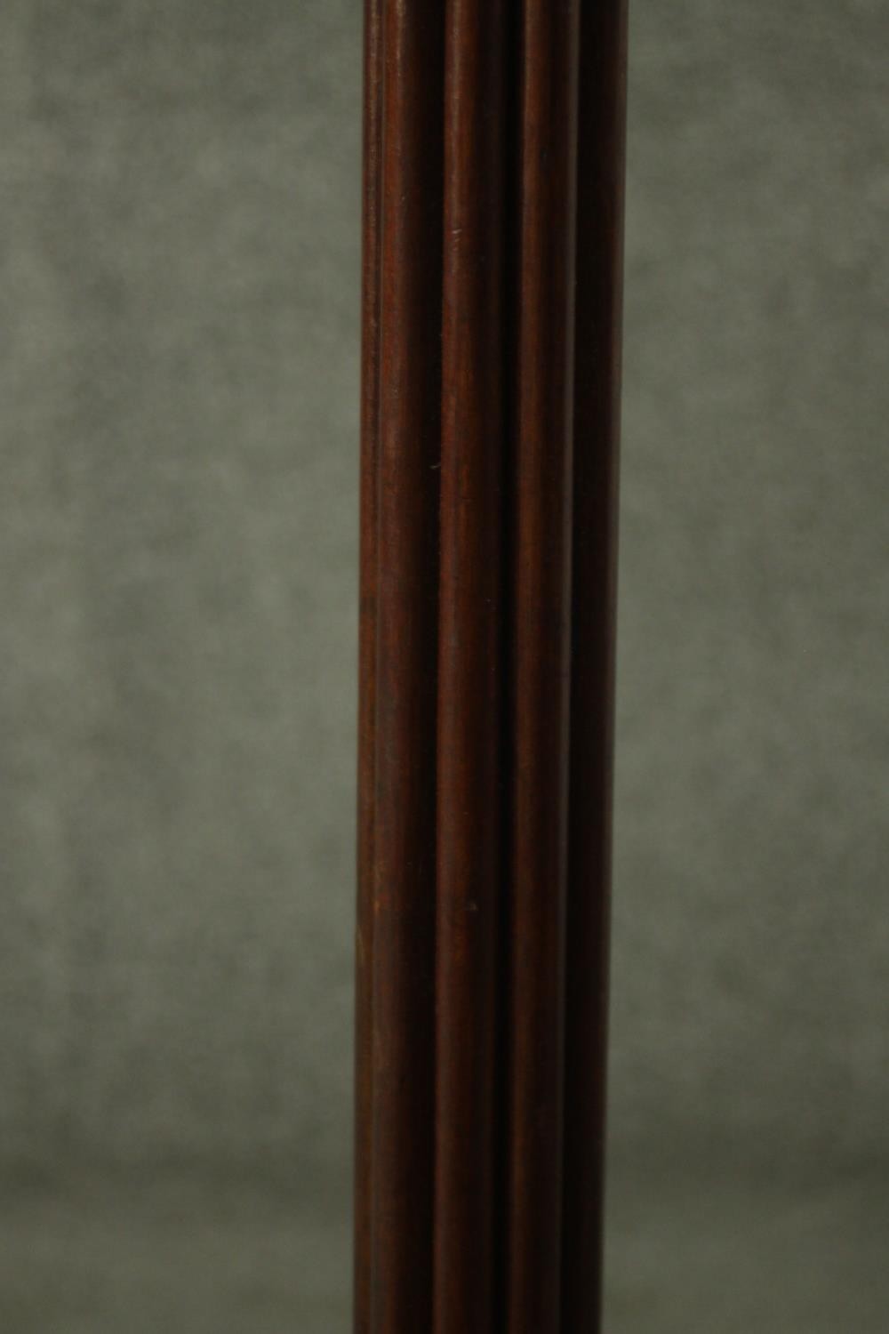 A Victorian mahogany torchere, with a circular top on a reeded stem, with a tripod base, terminating - Image 5 of 5