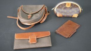 A Louis Vuitton purse along with a Mulberry saddle bag, wallet and purse. H.23 W.20cm (largest)
