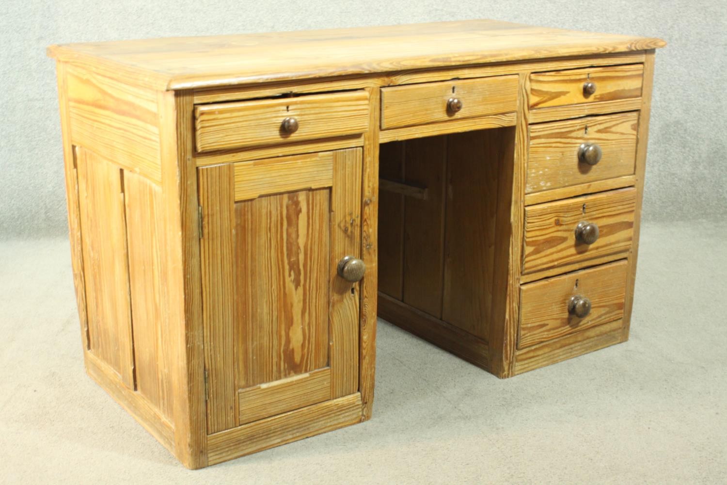 A Victorian pitch pine kneehole desk, with three short drawers, over a cupboard door to one - Image 4 of 8