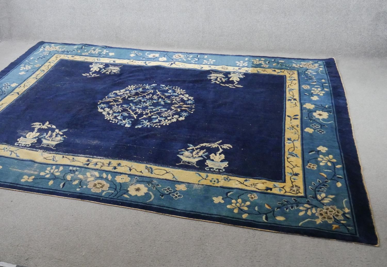 A blue ground hand made Antique Art Deco Chinese carpet. (joined) L.278 W.204cm