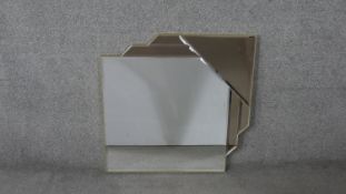 A contemporary Art Deco style frameless mirror, with a bevelled square mirror plate, having a canted