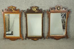 Three George III design mahogany and parcel gilt fretwork mirrors, each with a carved and gilt ho-ho
