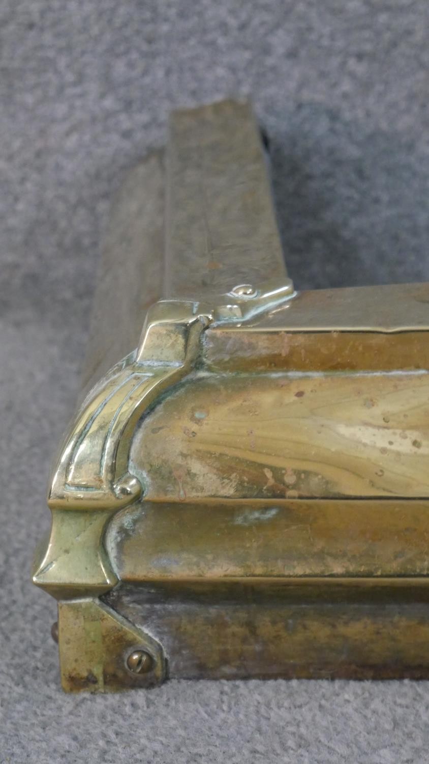 An Arts and crafts style brass fender with applied detailing. (Loose) H.11 W.120 D.39cm - Image 3 of 4