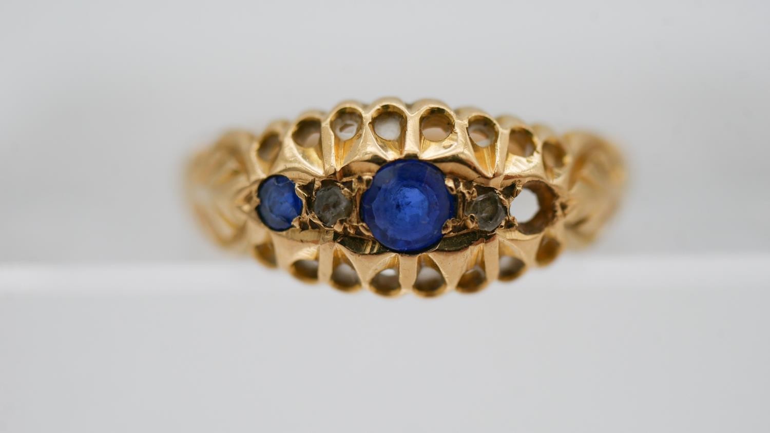 An 18 carat yellow gold sapphire and diamond gypsy ring, set with two round mixed cut sapphires - Image 5 of 10