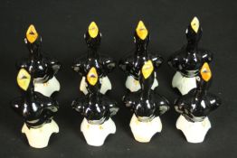 Eight vintage ceramic pie funnels in the form of singing black birds.