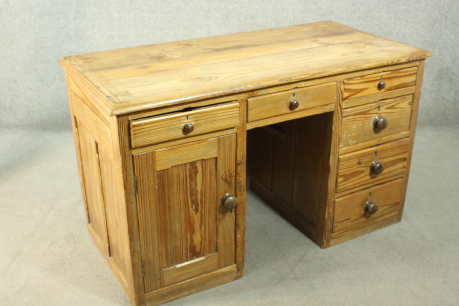 A Victorian pitch pine kneehole desk, with three short drawers, over a cupboard door to one - Image 5 of 8