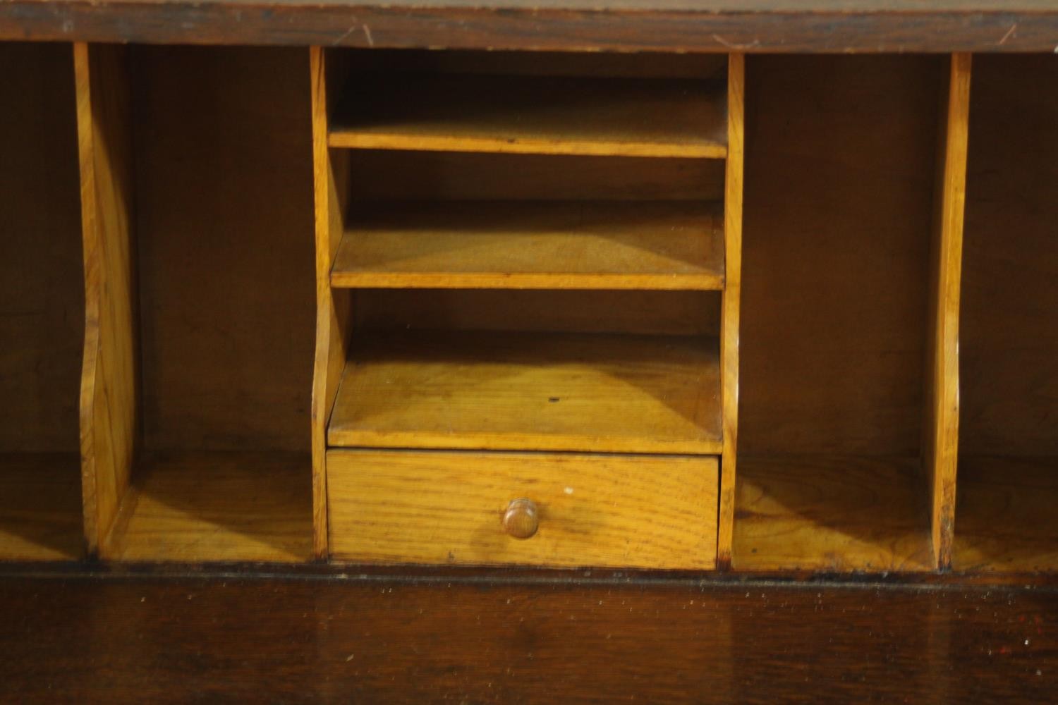 An early 20th century oak bureau, the fall front opening to reveal a fitted interior consisting of - Image 4 of 8