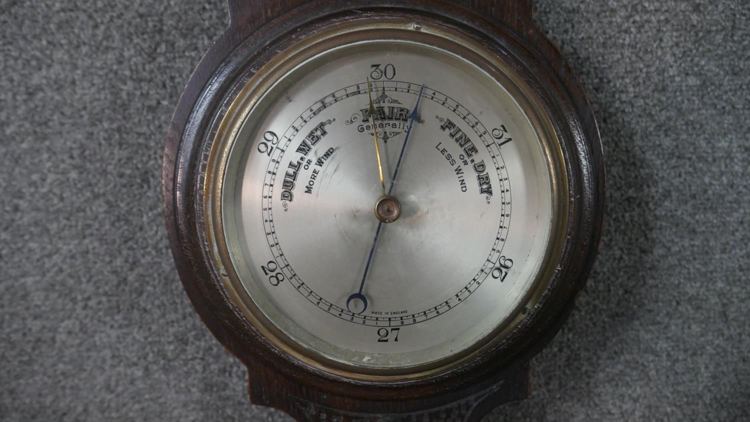 A late 19th century carved oak cased barometer with silvered dial. H.72 W.24cm - Image 4 of 5