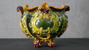A 19th century floral decorated green glazed jardiniere. H.33 W.43cm