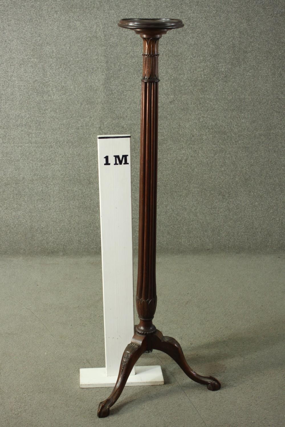 A Victorian mahogany torchere, with a circular top on a reeded stem, with a tripod base, terminating - Image 2 of 5