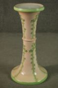 A Victorian jardiniere on stand with all over floral glazed decoration. H.85cm Dia.31cm.