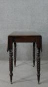 A Victorian mahogany drop leaf dining table, with turned and wrythen legs. H.70 W.93cm (Extended)