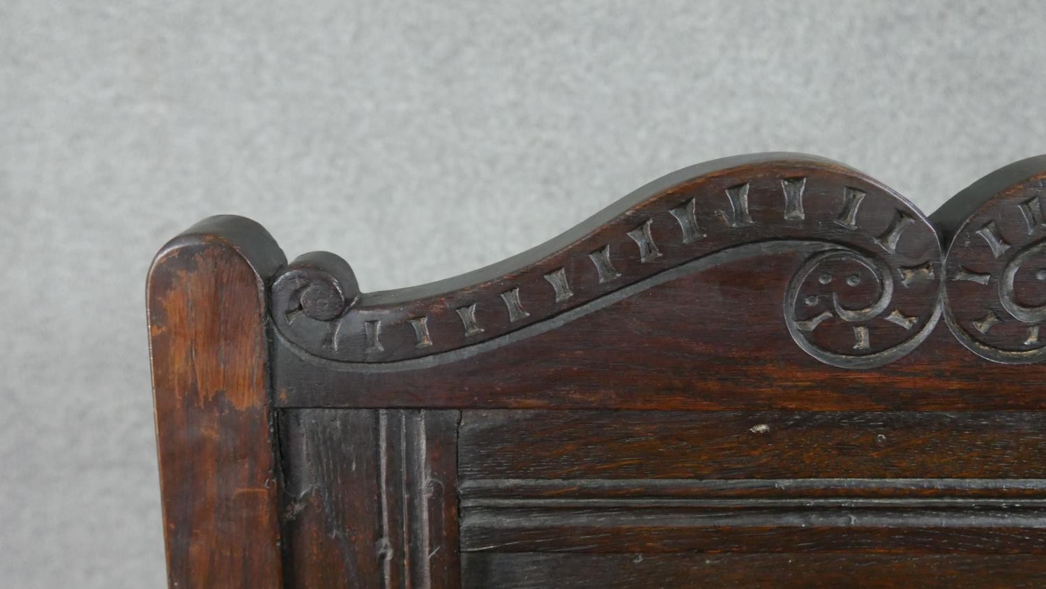 A late 19th century oak wainscot armchair, the panelled back with scrolling top rail, over open - Image 6 of 6