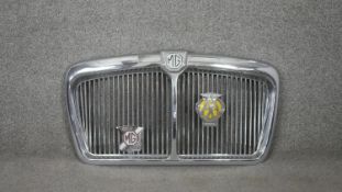 A vintage polished chrome MG car grille, with attached AA badge and MG Car Club badge. H.39 W.68cm