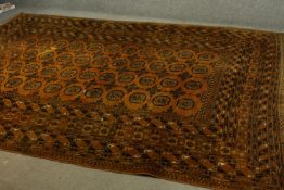 A gold ground hand made Afghan carpet. L.300 W.205cm