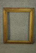 A 19th century moulded gilt wood picture frame. H.70 W.55cm.