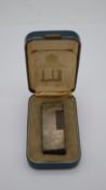 A vintage Dunhill lighter, marked to base and in original case. H.3 W.5 D.9cm (boxed)
