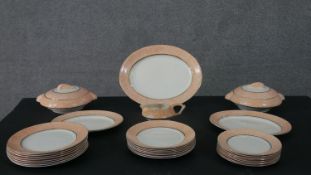 An Art Deco Tams Ware china orange circle design eight person part dinner service, including two