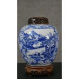 A Chinese blue and white porcelain vase of ovoid form, with two pictorial reserves, one depicting