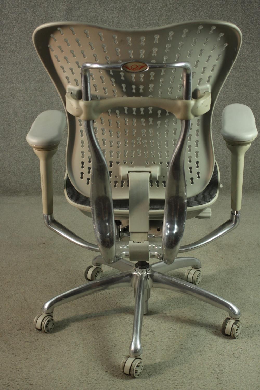 A Formway style office chair, in grey, with a pierced back, and adjustable arms, on a five point - Image 5 of 9