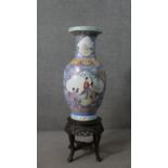 A Chinese famille rose poecelain vase, with figural pictorial reserves, painted with flowers on a