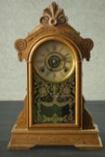 A late 19th century American Ansonia type oak cased mantel clock with eight day movement. H.52 W.