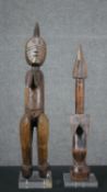 Two carved hardwood African figures on perspex bases. H.50cm (largest)