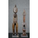 Two carved hardwood African figures on perspex bases. H.50cm (largest)