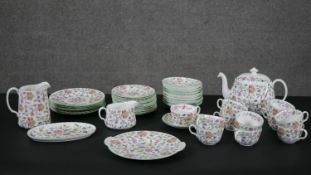 A Minton Haddon Hall tea service designed by John Wadsworth, marked to underside. (For twelve with