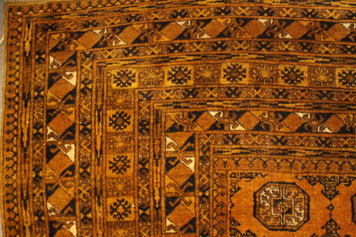 A gold ground hand made Afghan carpet. L.300 W.205cm - Image 5 of 6