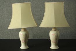 A pair of ceramic baluster form table lamps and a similar marble example. H.63cm (largest)