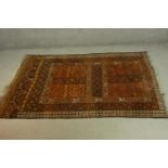 A gold ground hand made Afghan rug. L.215 W.150cm