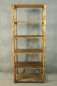 A Victorian style pine whatnot, of six tiers with turned baluster supports. H.216 W.84 D.50cm.