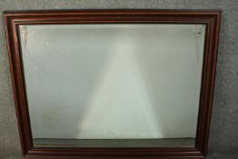 A 20th century rectangular fruitwood framed mirror, with a moulded frame and a bevelled mirror