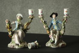 Two 19th century Meissen hand painted porcelain figural design candelabras, male and female