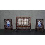 Three Chinese rosewood table screens, the largest set with twelve monochrome porcelain panels