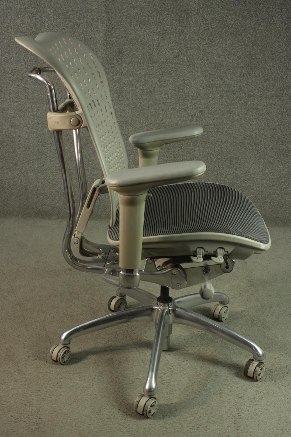 A Formway style office chair, in grey, with a pierced back, and adjustable arms, on a five point - Image 3 of 9