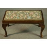 A Georgian style oak stool, early 20th century, the drop-in seat upholstered in foliate tapestry, on