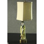 A vintage Japanese table lamp and shade with figural base. H.74cm.