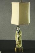A vintage Japanese table lamp and shade with figural base. H.74cm.