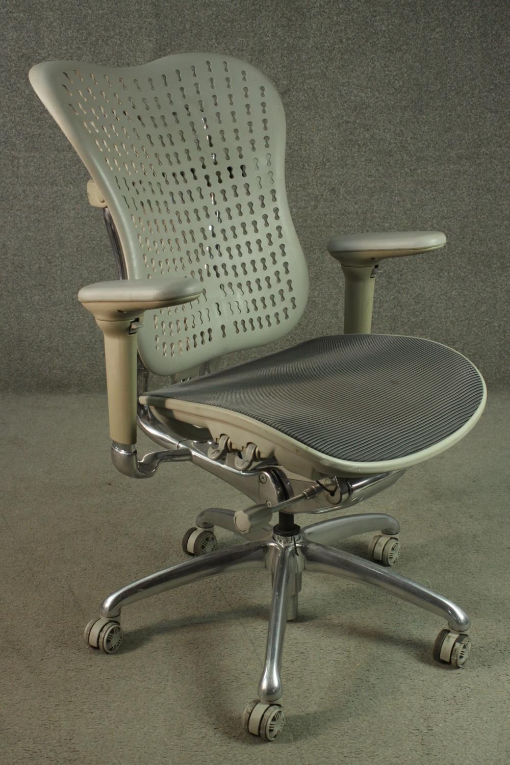 A Formway style office chair, in grey, with a pierced back, and adjustable arms, on a five point - Image 2 of 9