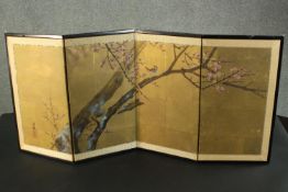 A small Japanese four fold screen, painted with a bird amongst blossom to one side, and a bird